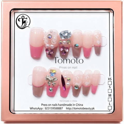 Tomoto A094 12 soft pink nude and rose pink French tip press on nails featuring iridescent crystals, pearl charms, delicate white floral art and butterfly bow decorations