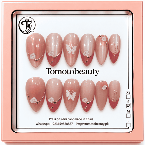 Tomoto Beauty B025: Blush pink shimmer almond nails featuring dusty rose French-tip sections, delicate white flowers and butterfly accents, and fine rose-gold curves