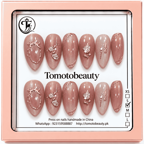 Tomoto Beauty B026: Soft rosy nude shimmer almond nails decorated with sculpted rose-gold frames, tiny white floral details and gently flowing metallic lines.