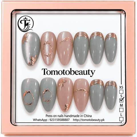 Tomoto Beauty B027: Pearlescent cool grey and blush pink almond nails with rose-gold foil-like French edges, floral or leaf accents and modern oval line art.