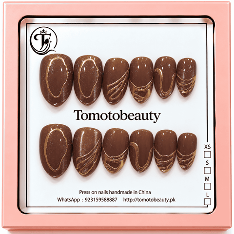 Tomoto Beauty B031: Deep chocolate-brown shimmer almond nails decorated with shiny gold oval outlines, fluid swirls and sculpted metallic accents.