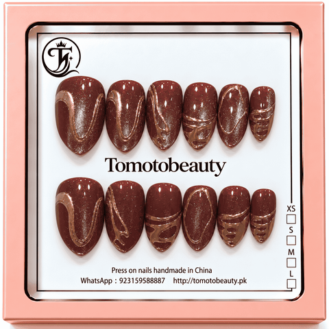 Tomoto Beauty B036: Glossy espresso-brown shimmer nails with sculpted gold swoops, oval frames and metallic abstract accents on almond tips.