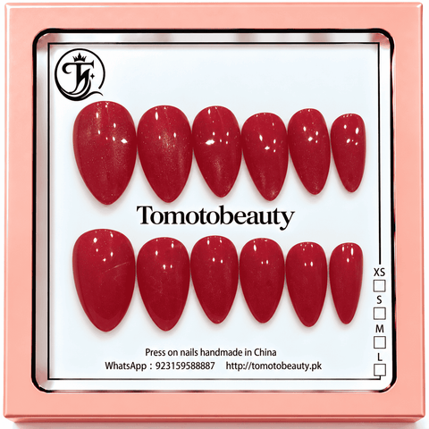 Tomoto Beauty B040: Bright crimson red almond shaped nails with a smooth glossy finish and fine sparkle. A bold, stylish manicure.