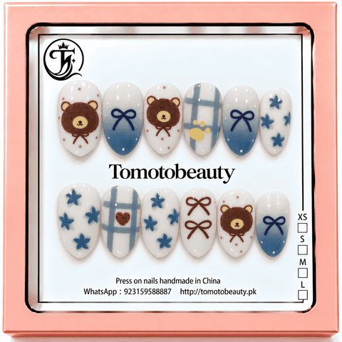 Tomoto Beauty B202 – Cute Teddy Bear Blue Bow Kids Press On Nails. White and powder blue nail art with brown teddy bear faces, blue ribbon bows, gingham checks and tiny blue flowers.