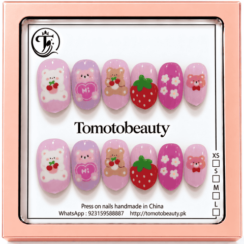 Tomoto Beauty B210 – Pink Teddy Bear Strawberry Kids Press On Nails. Sweet pastel pink nails with teddy bear illustrations, little cherries, a red strawberry and small white daisies.