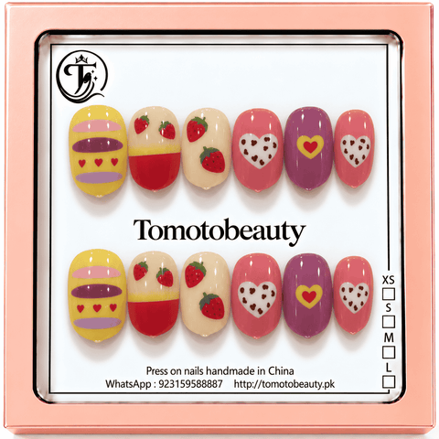 Tomoto Beauty B211 – Strawberry Love Hearts Cartoon Kids Press On Nails. Yellow, berry pink, cream and purple nail art with strawberries, cute hearts and playful striped patterns.