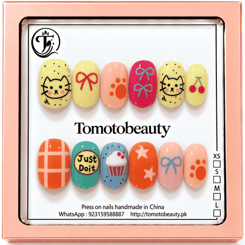Tomoto Beauty B213 – Yellow Kitty Cherry Bow Kids Press On Nails. Yellow, orange, pink, teal and blue nail set with cute kitty faces, bows, cherries, a cupcake and star accents.