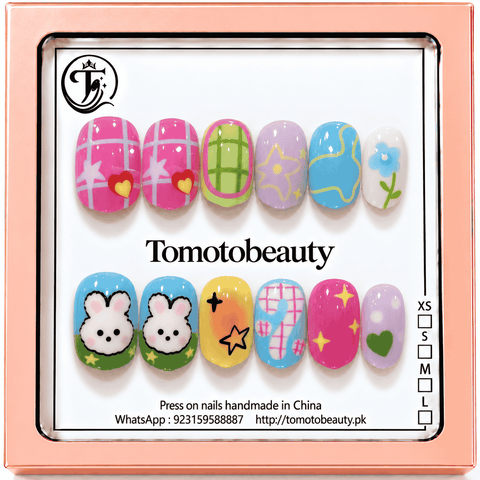 Tomoto Beauty B215 – Pastel Bunny Gingham Star Kids Press On Nails. Cute pink gingham and sky blue bunny designs with yellow stars, lavender accents and small green hearts.