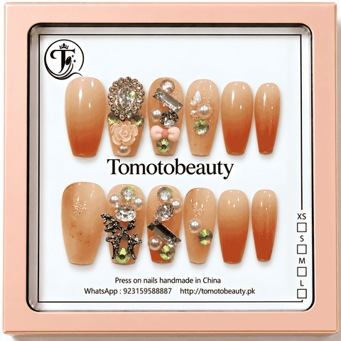 Tomoto Beauty A002 12 nude peach ombre press on nails with orange gradient tips, sparkling crystals, pearls, flower and bow embellishments