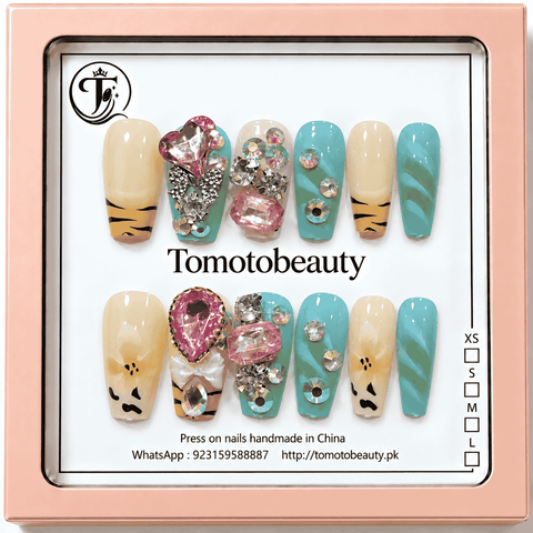 Tomoto Beauty A003 12 turquoise blue and cream tiger print press on nails with pink heart crystals, rhinestones, bows and glossy swirled accents