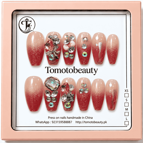 Tomoto Beauty A005 12 red glitter ombre press on nails with nude peach gradient, crystal heart gems, rhinestones, silver bow and 3D floral accents