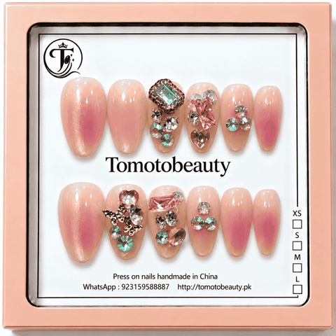 Tomoto Beauty A016 12 peach pink aura press on nails with pearlescent shine, pink gems, silver rhinestones and butterfly accents